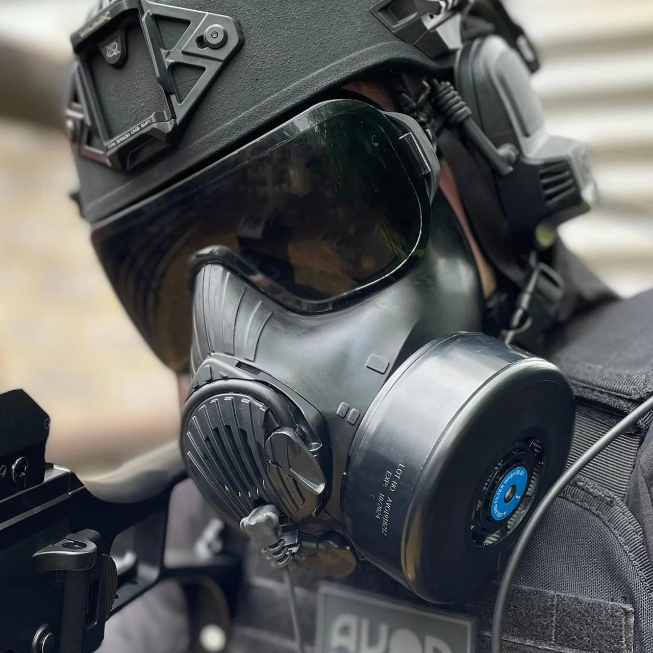 Operator in a helmet and headset wearing the C50 with filter fitted